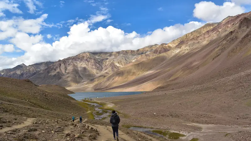 A trekker on the trail into the arid Lahaul side of Hampta Pass